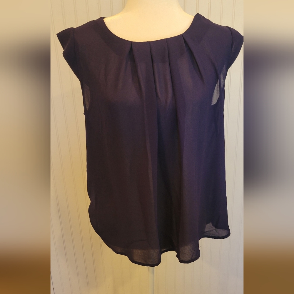 Twine and string navy cap sleeve blouse with a button up back and ruching front